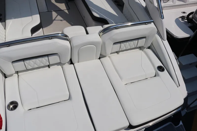 Slide: The Image of 2023 Regal LS6 boat with luxurious white seating and sleek design. - 15