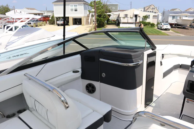 Slide: The Image of 2023 Regal LS6 boat interior with sleek seating and modern design. - 8