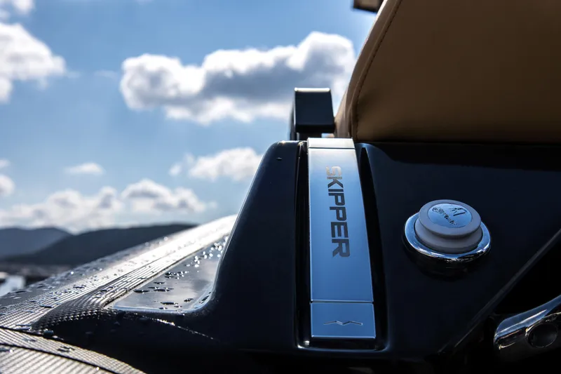Slide: The Image of Close-up of 2024 Skipper-BSK 38NC boat dashboard with blue sky background. - 15