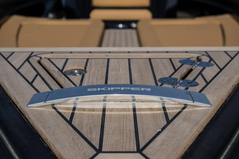 Slide: The Image of 2024 Skipper-BSK 38NC boat deck with logo and sleek design. - 19