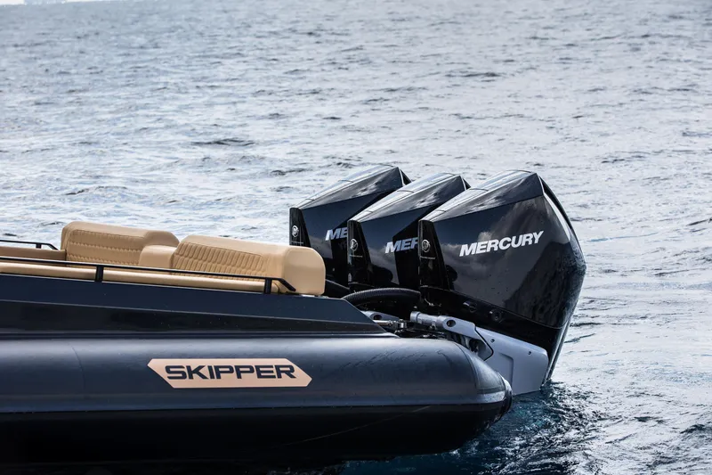 Slide: The Image of 2024 Skipper-BSK 38NC boat with dual Mercury engines on water. - 24
