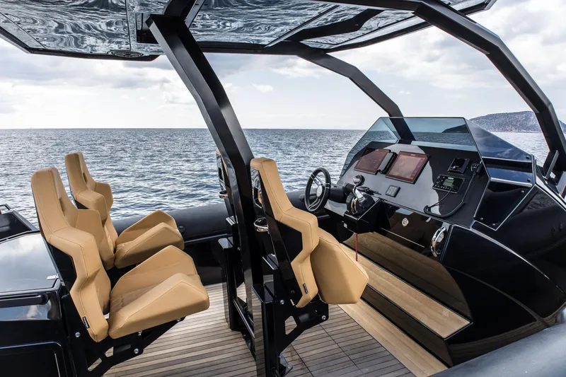 Slide: The Image of 2024 Skipper-BSK 38NC boat interior with tan seats and modern dashboard. - 26
