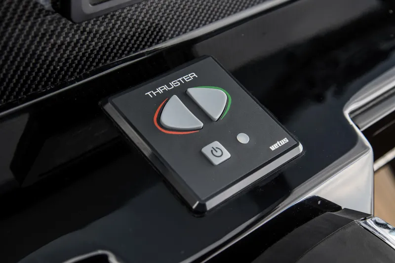 Slide: The Image of Skipper-BSK 38NC 2024 thruster control panel with power button and directional controls. - 43