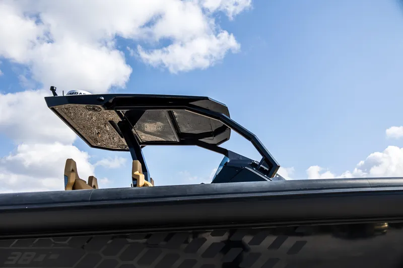 Slide: The Image of 2024 Skipper-BSK 38NC boat with sleek design against a blue sky. - 15