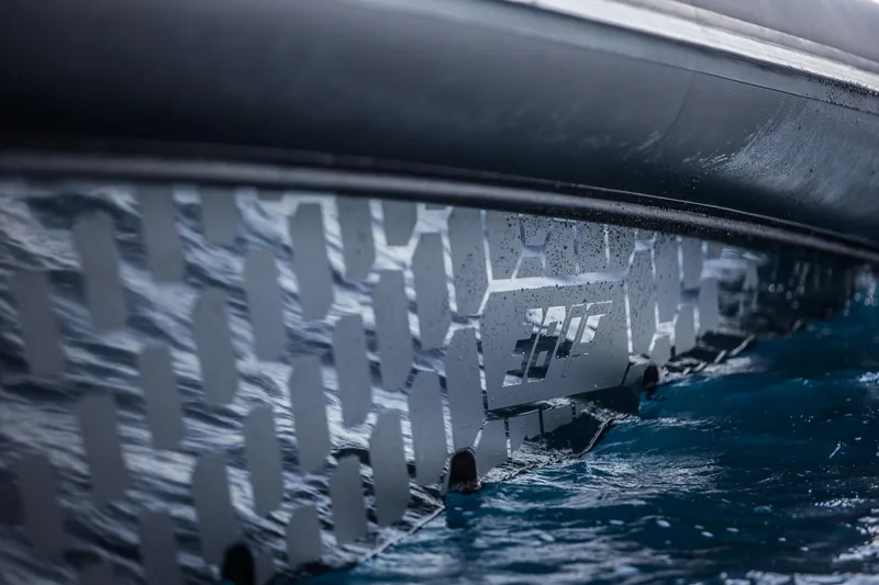 Slide: The Image of Close-up of Skipper-BSK 38NC 2024 boat hull in water. - 25