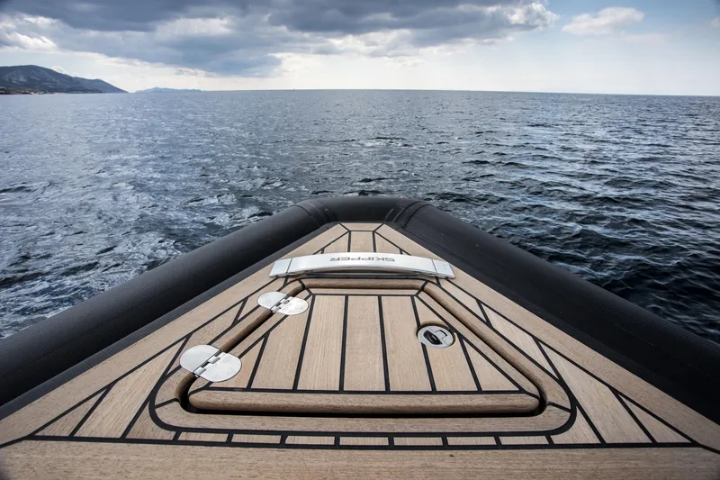 Slide: The Image of Bow view of 2024 Skipper-BSK 38NC boat on open water. - 39