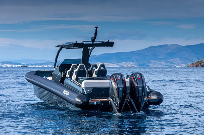 Slide: The Image of 2024 Skipper-BSK 38NC boat with dual outboard motors on the water. - 4