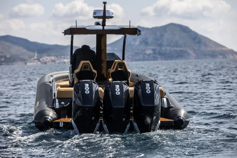 Slide: The Image of 2024 Skipper-BSK 38NC boat with triple outboard engines cruising on the sea. - 0