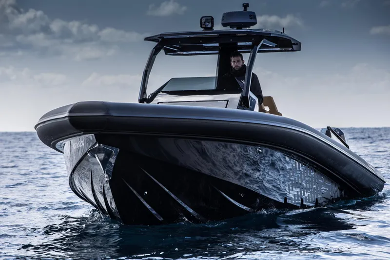 Slide: The Image of 2024 Skipper-BSK 38NC luxury speedboat on open water. - 10