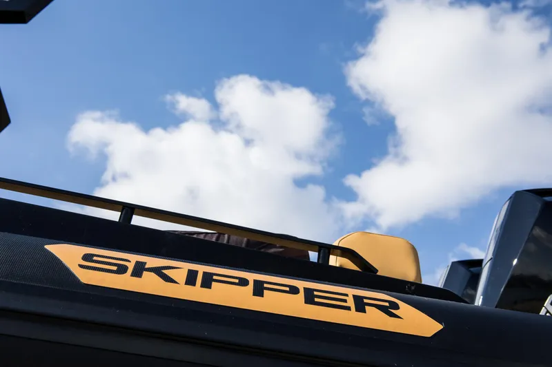 Slide: The Image of 2024 Skipper-BSK 38NC boat against a blue sky with clouds. - 16
