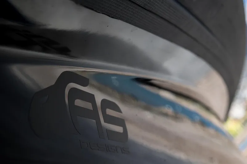 Slide: The Image of Close-up of Skipper-BSK 38NC 2024 boat hull with AS Designs logo. - 17