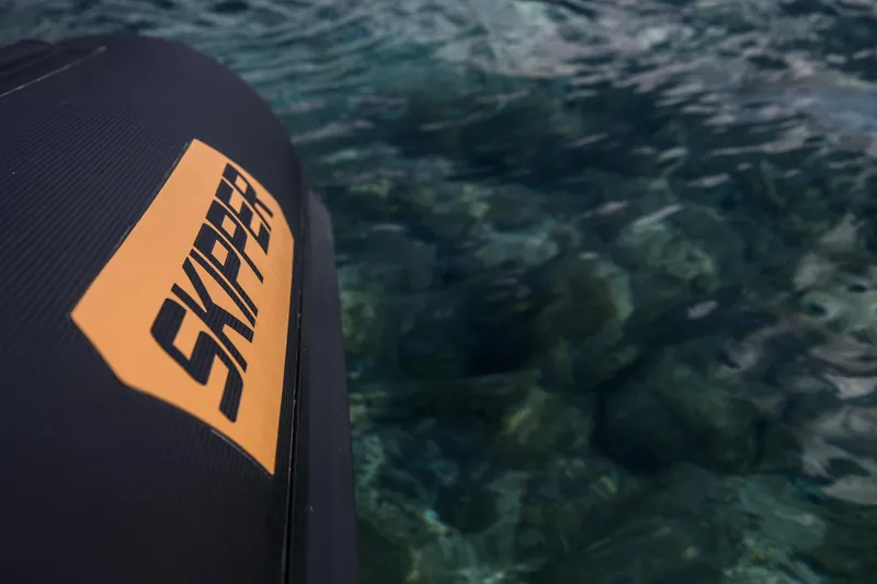 Slide: The Image of Close-up of Skipper-BSK 38NC boat on clear water, 2024 model. - 22