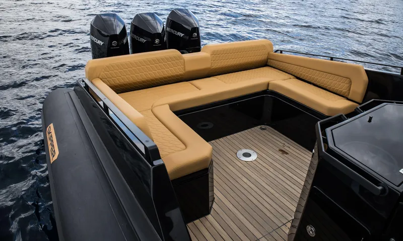 Slide: The Image of Luxury Skipper-BSK 38NC 2024 boat with tan seating and triple Mercury outboard engines. - 49