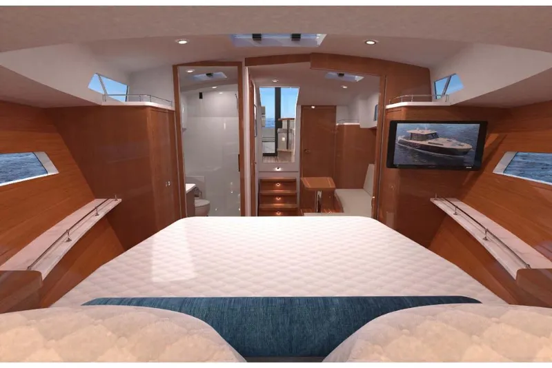 Slide: The Image of Luxurious interior of 2023 MJM 42 yacht with bed, TV, and wooden finishes. - 12