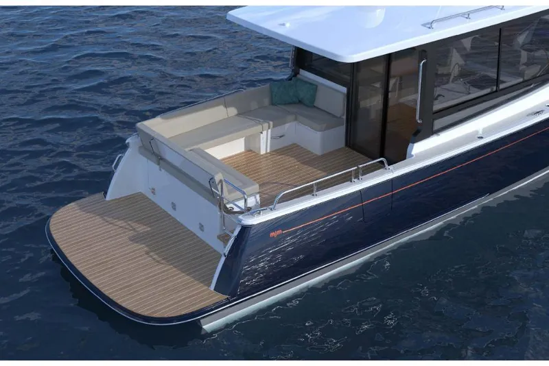 Slide: The Image of 2023 MJM 42 yacht with spacious deck and seating area. - 3