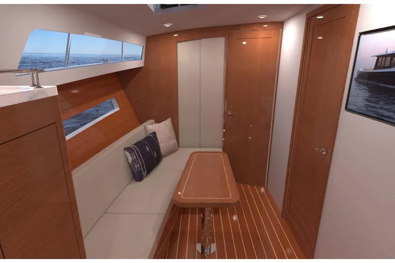 Slide: The Image of 2023 MJM 42 yacht interior with wooden finishes and seating area. - 9