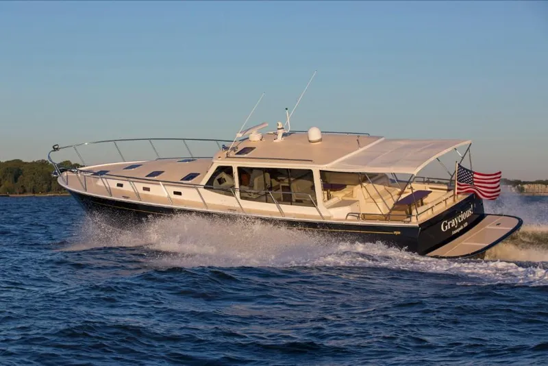 Slide: The Image of 2023 MJM 50z yacht cruising on open water. - 16