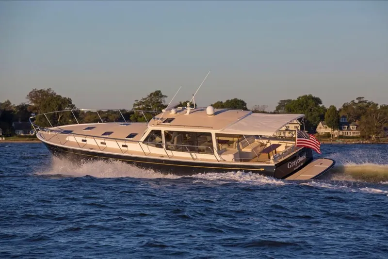 Slide: The Image of 2023 MJM 50z yacht cruising on a serene waterway. - 17