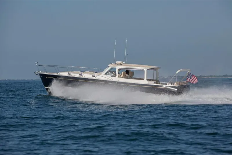 Slide: The Image of 2023 MJM 50z yacht cruising on open water. - 5