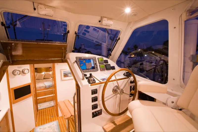 Slide: The Image of 2023 MJM 40z yacht interior with helm station and cozy cabin. - 17