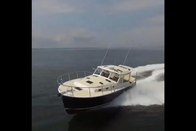 Slide: The Image of 2023 MJM 40z yacht cruising on open water. - 4