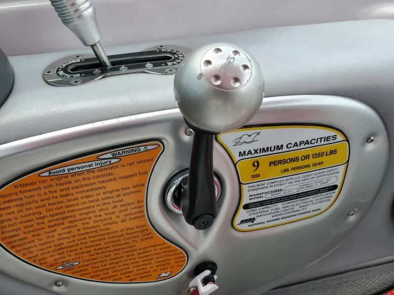 Slide: The Image of 2005 Correct Craft SV-211 Limited boat controls with capacity warning label. - 24