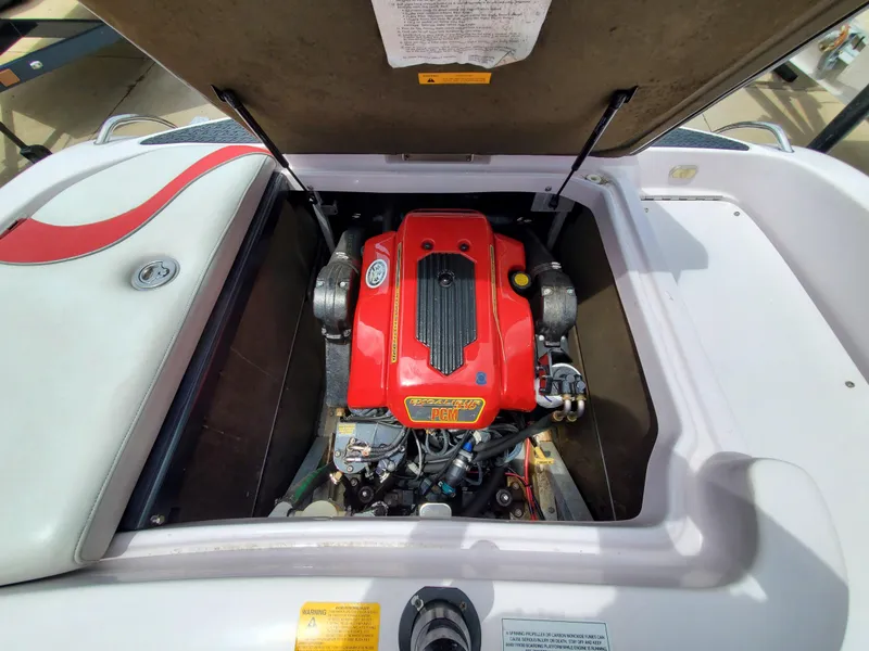 Slide: The Image of 2005 Correct Craft SV-211 Limited engine compartment with red engine cover. - 29