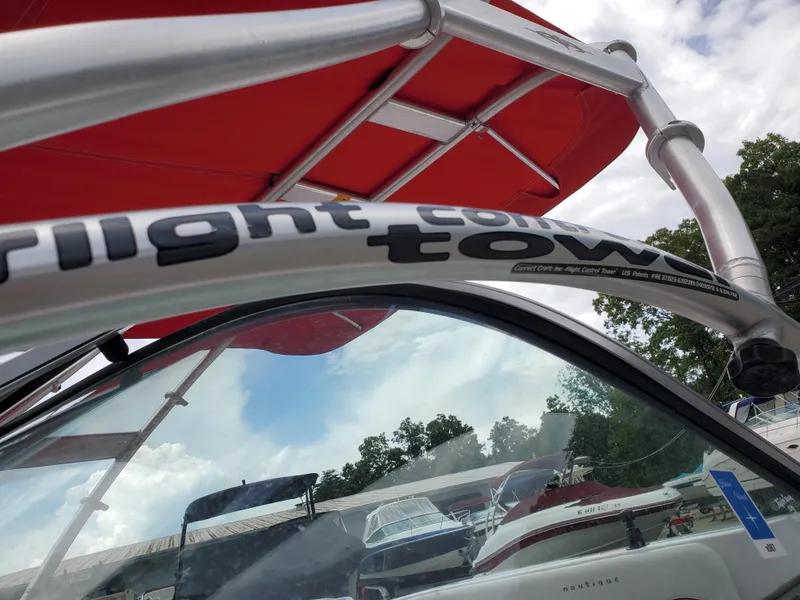 Slide: The Image of 2005 Correct Craft SV-211 Limited boat with red canopy and Flight Control Tower. - 31