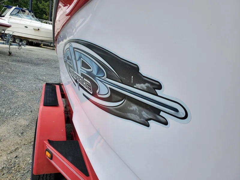 Slide: The Image of 2005 Correct Craft SV-211 Limited boat with red trailer and distinctive logo. - 35