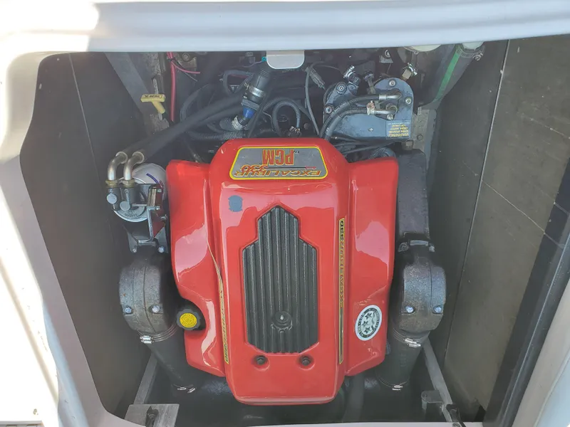 Slide: The Image of 2005 Correct Craft SV-211 Limited engine with red PCM cover, detailed view. - 38