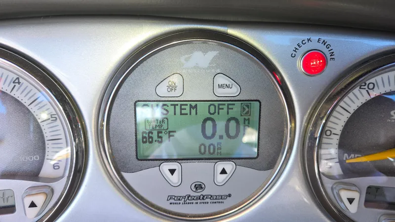 Slide: The Image of Dashboard of 2005 Correct Craft SV-211 Limited with digital display and check engine light. - 40