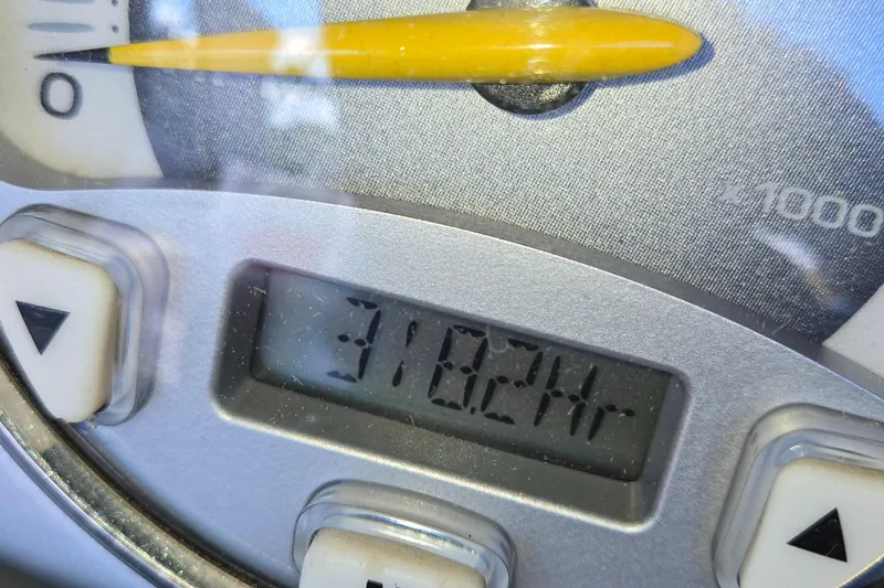 Slide: The Image of Close-up of a 2005 Correct Craft SV-211 Limited boat hour meter displaying 318.2 hours. - 41