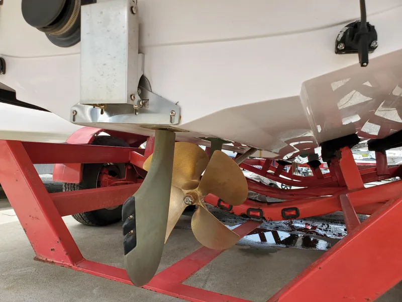 Slide: The Image of 2005 Correct Craft SV-211 Limited boat propeller on red trailer. - 7
