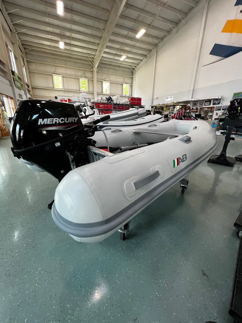 Slide: The Image of 2023 AB Inflatables Lammina 9 UL boat with Mercury outboard motor in showroom. - 4