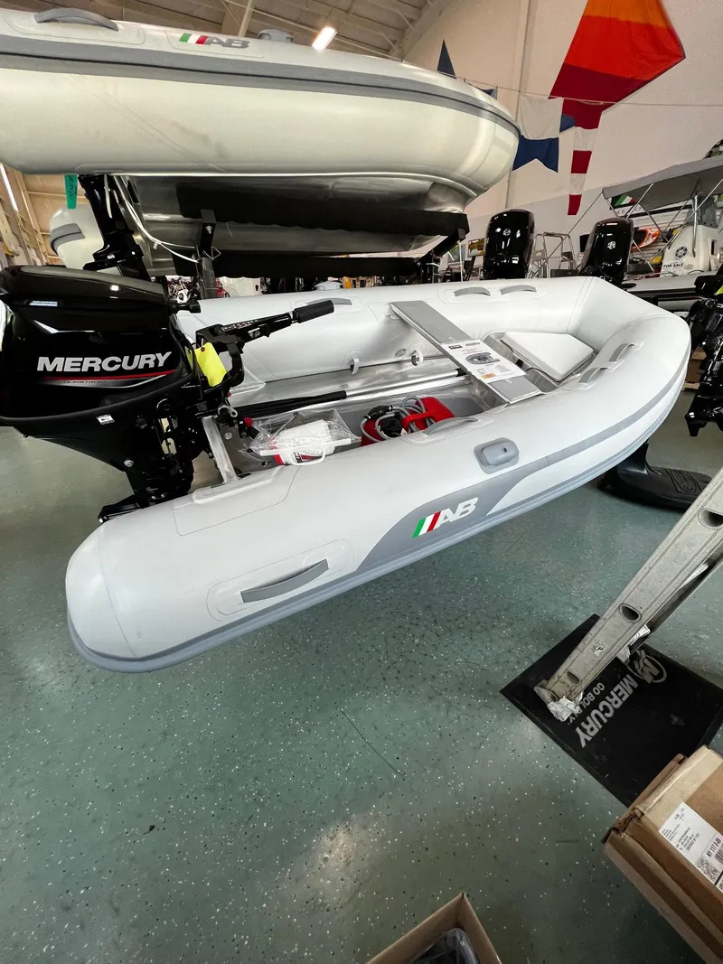 The Image of 2023 AB Inflatables Lammina 9 AL boat with Mercury outboard motor in showroom. - 0