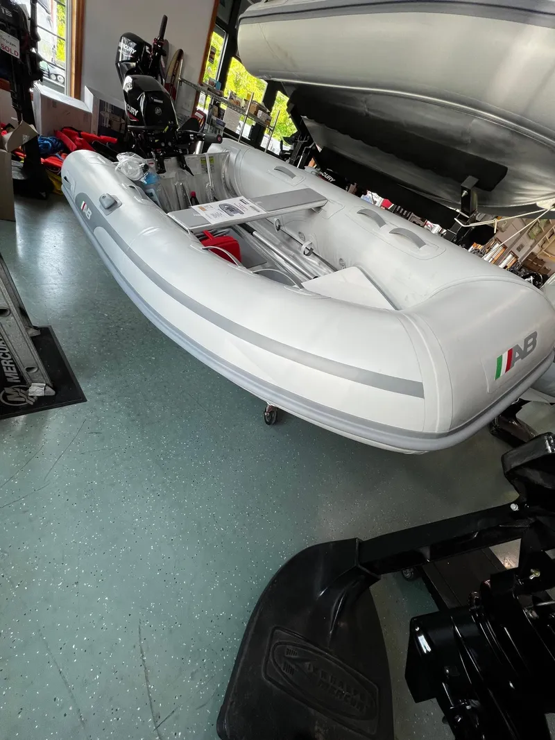 Slide: The Image of 2023 AB Inflatables Lammina 9 AL inflatable boat displayed indoors. - 3