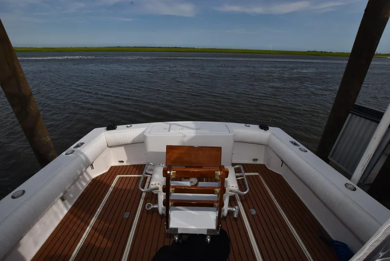 Slide: The Image of 2001 Carolina Classic Express with Marlin Tower, spacious deck overlooking calm waters. - 8