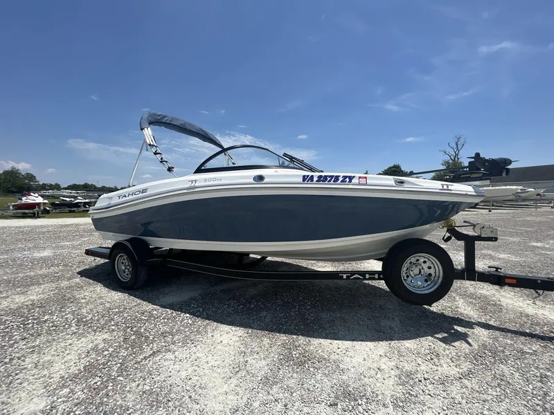 The Image of 2017 Tahoe 500 TF boat on trailer in outdoor lot. - 1