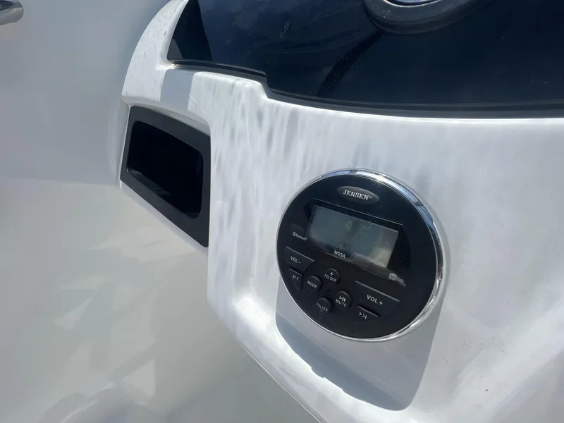 Slide: The Image of Close-up of 2017 Tahoe 500 TF boat dashboard with Jensen stereo system. - 10
