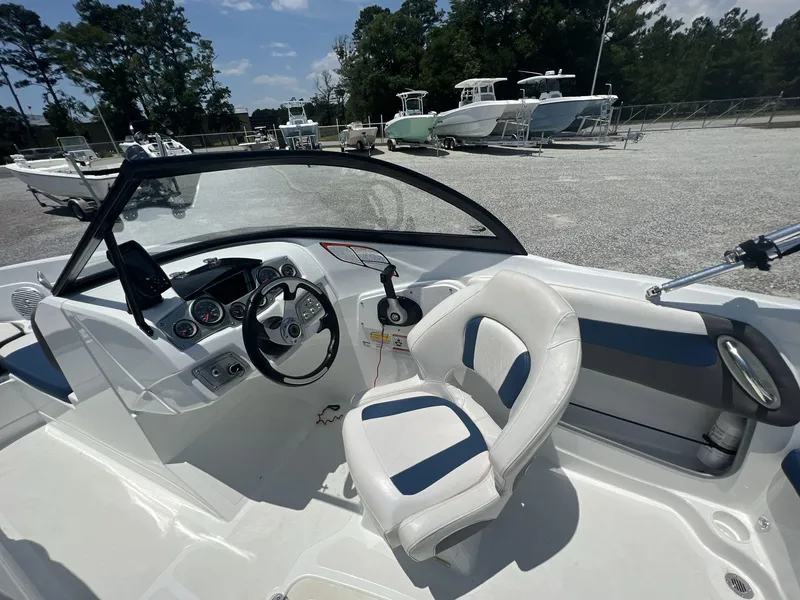 Slide: The Image of 2017 Tahoe 500 TF boat interior with steering wheel and captain's chair. - 4