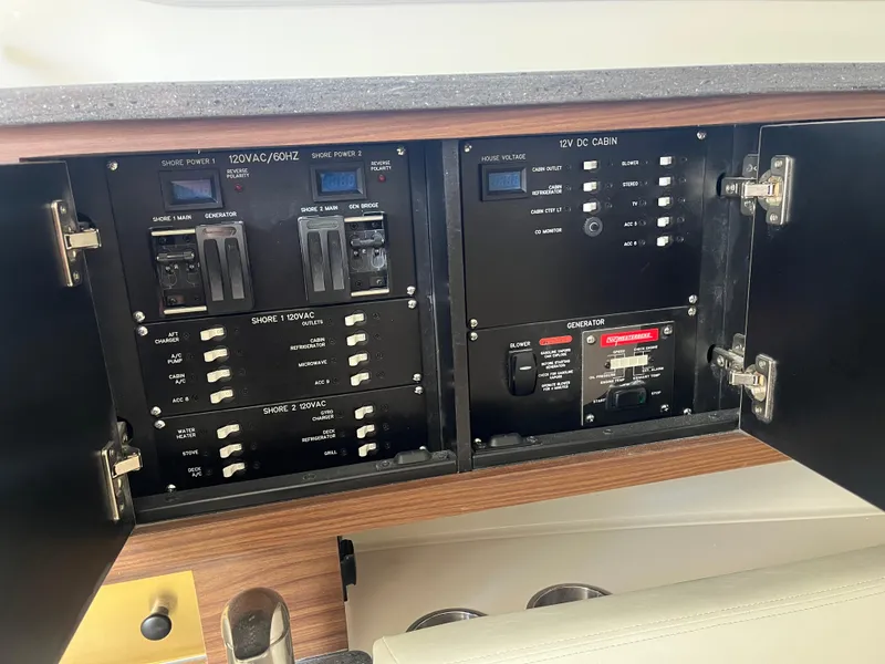 Slide: The Image of Electrical panel of 2025 Boston Whaler 325 Conquest boat, featuring various switches and controls. - 15