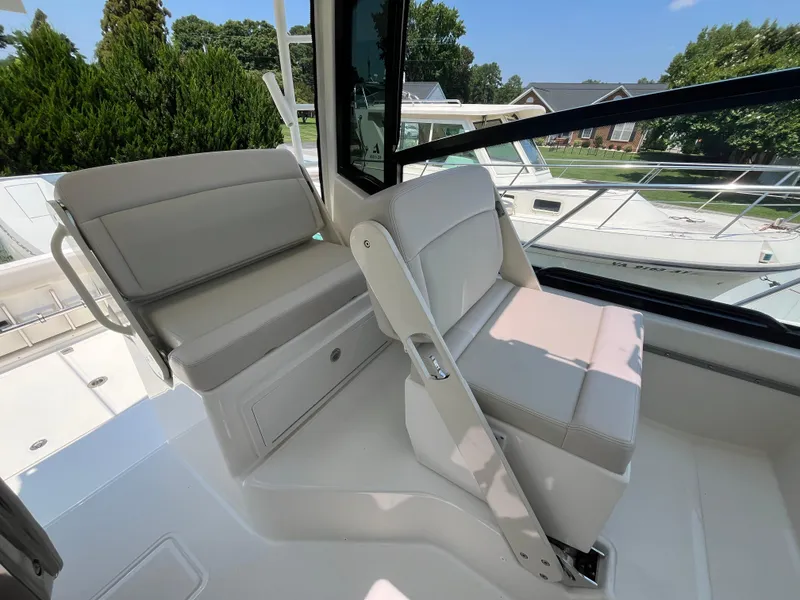 Slide: The Image of 2025 Boston Whaler 325 Conquest interior seating with modern design and comfort features. - 20