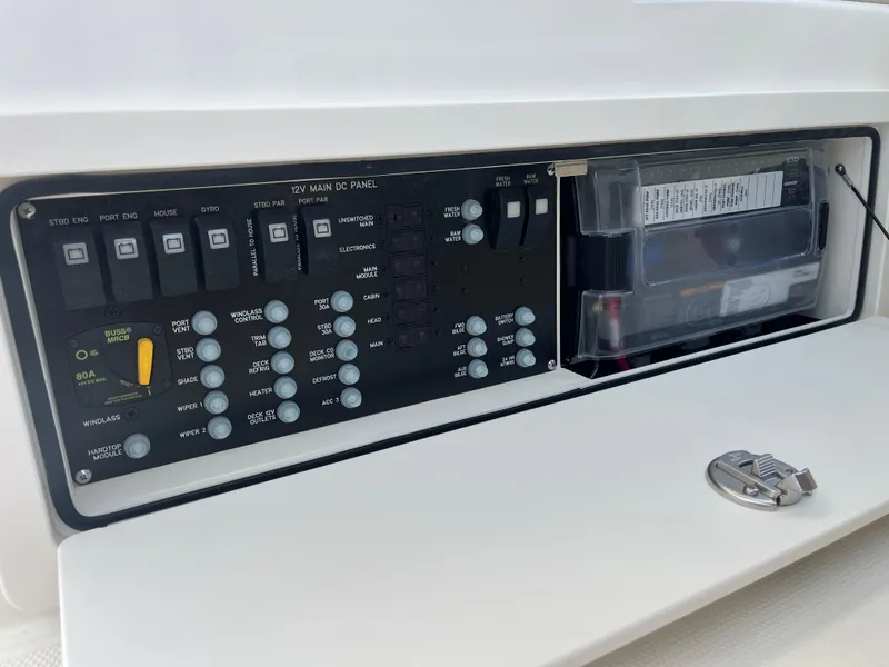 Slide: The Image of Control panel of 2025 Boston Whaler 325 Conquest boat, featuring various switches and indicators. - 21