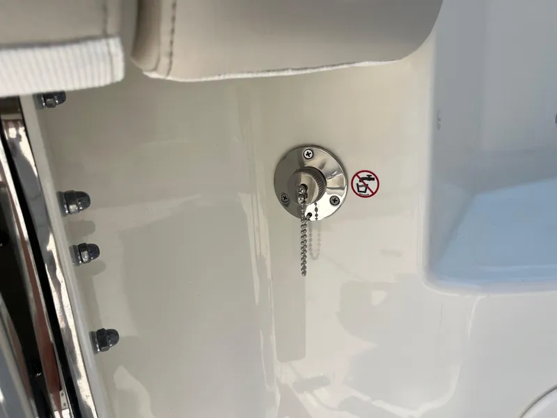 Slide: The Image of Fuel cap on 2025 Boston Whaler 325 Conquest boat with no refueling symbol. - 41
