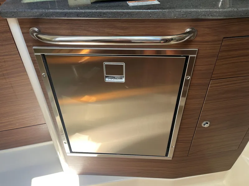 Slide: The Image of Stainless steel Isotherm fridge on 2025 Boston Whaler 325 Conquest boat. - 9