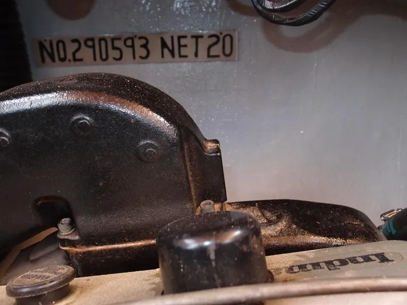 Slide: The Image of Close-up of a 1961 Hatteras Convertible engine part with serial number NO.290593 NET20. - 26