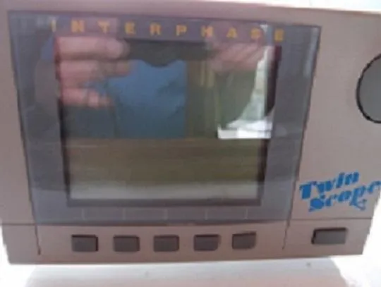 Slide: The Image of Interphase Twin Scope display on a 1961 Hatteras Convertible boat. - 29