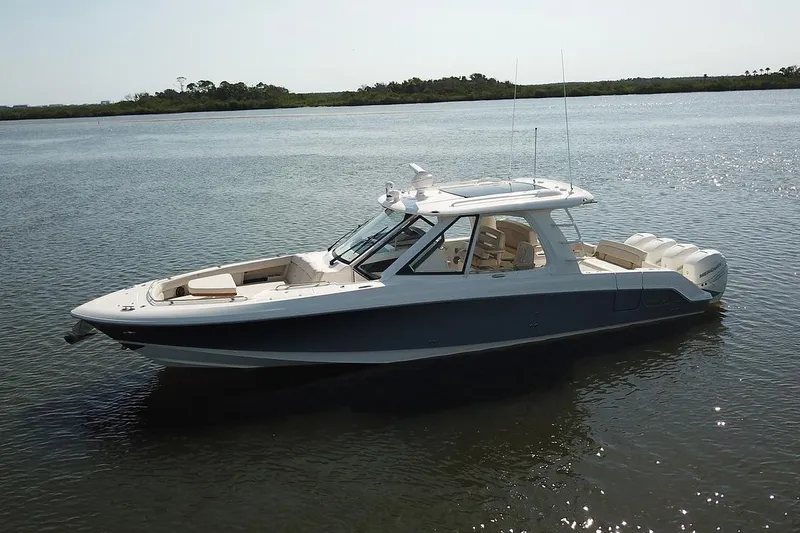 The Image of 2026 Boston Whaler 380 Realm boat cruising on water, custom order available. - 0