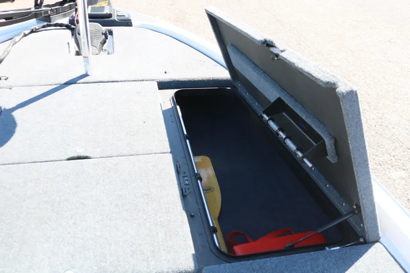 Slide: The Image of Open storage compartment on a 2009 Skeeter 20i boat, showcasing interior space. - 10