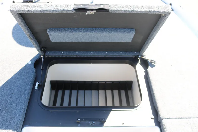 Slide: The Image of Open storage compartment on a 2009 Skeeter 20i boat, featuring a spacious interior. - 11